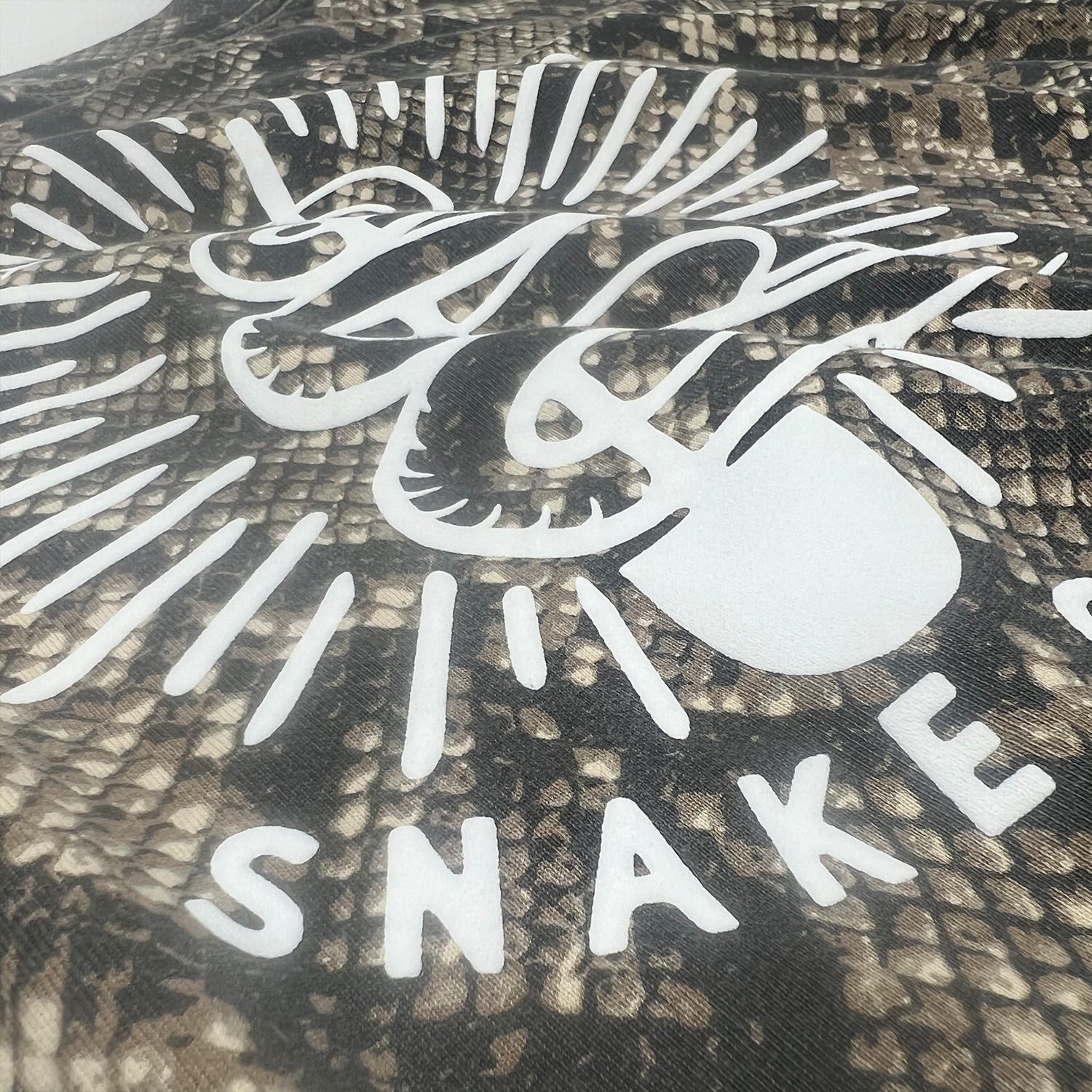 Snakecharmer SS Tee - Puff ink on Rattlesnake Blank